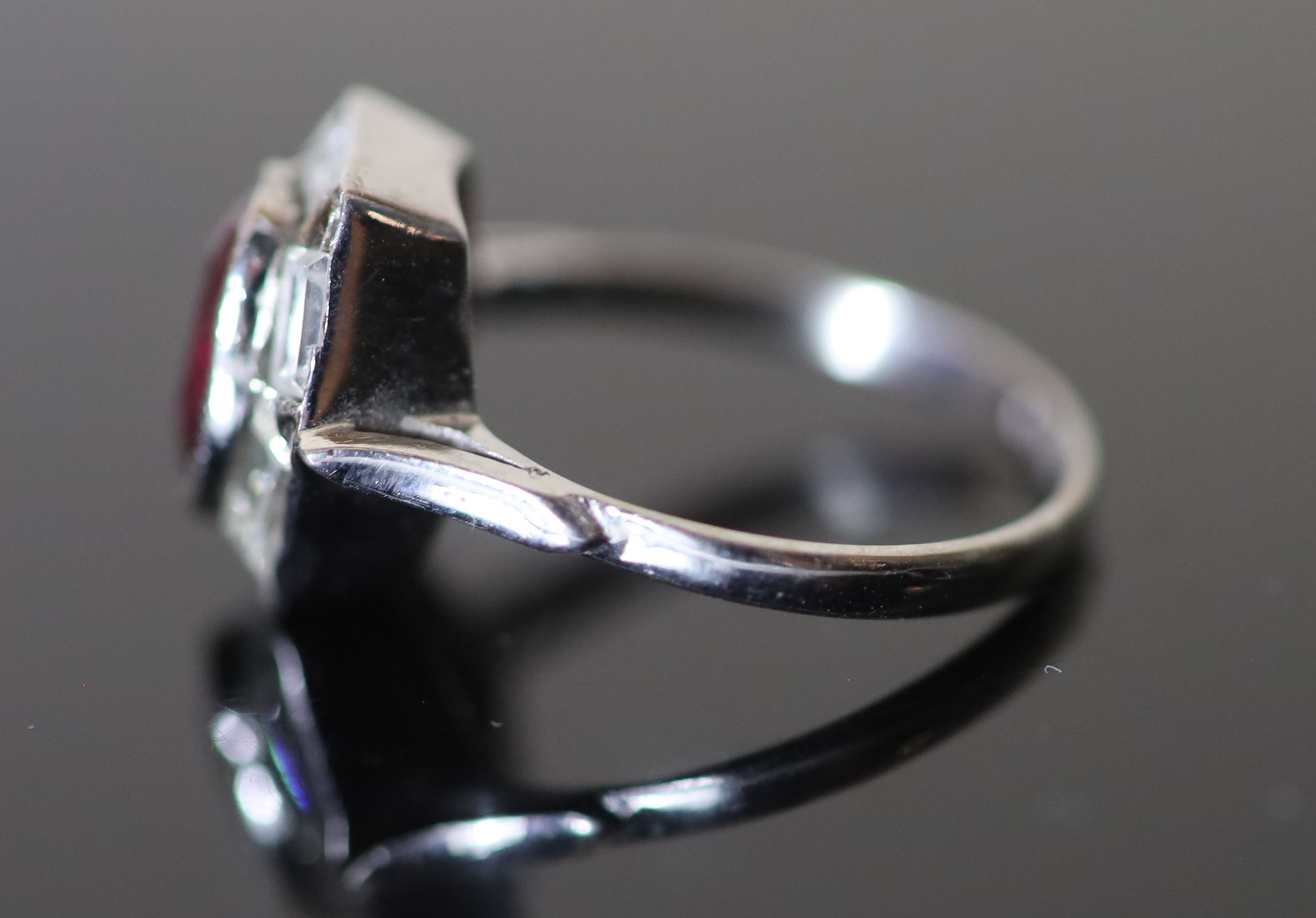 A modern platinum, pinkish/red tourmaline and six stone baguette cut diamond set hexagonal cluster ring,